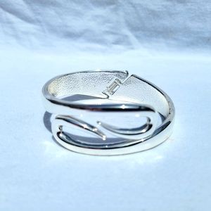 Curl hook hinged bangle bracelet polished silver tone metal